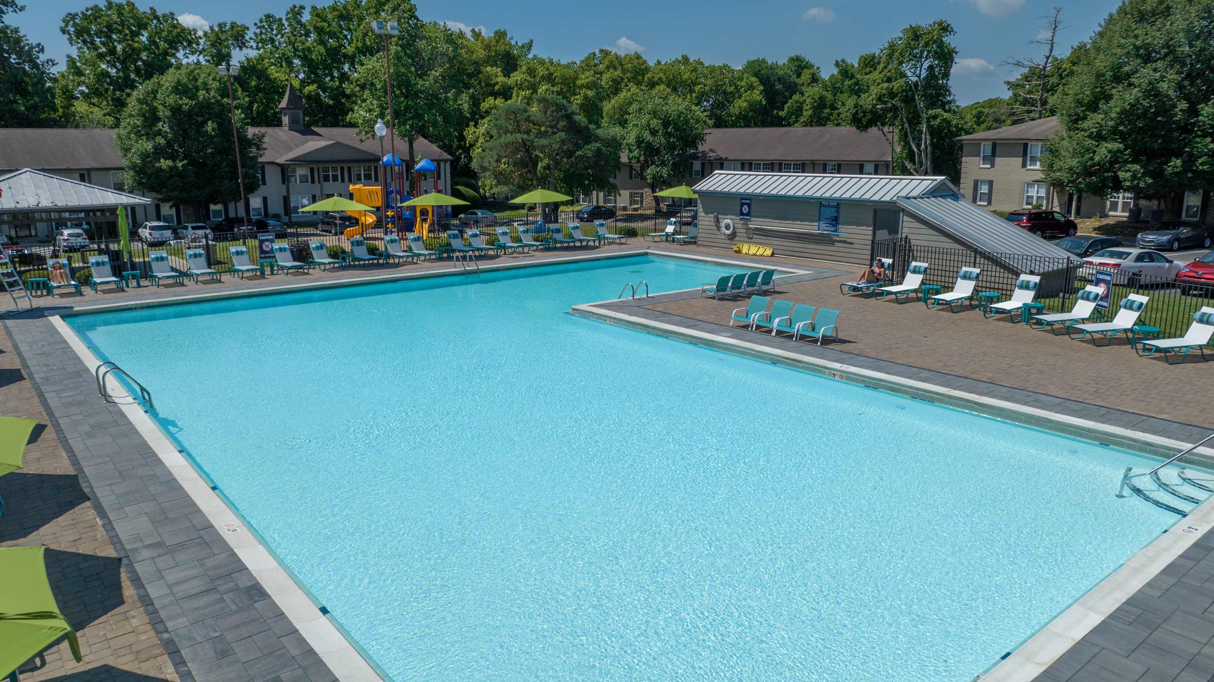 Resort-style pool with sundeck and lounge chairs